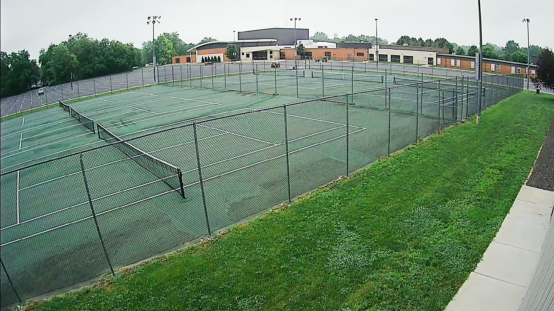 Security camera footage after HD upgrade on outdoor tennis courts