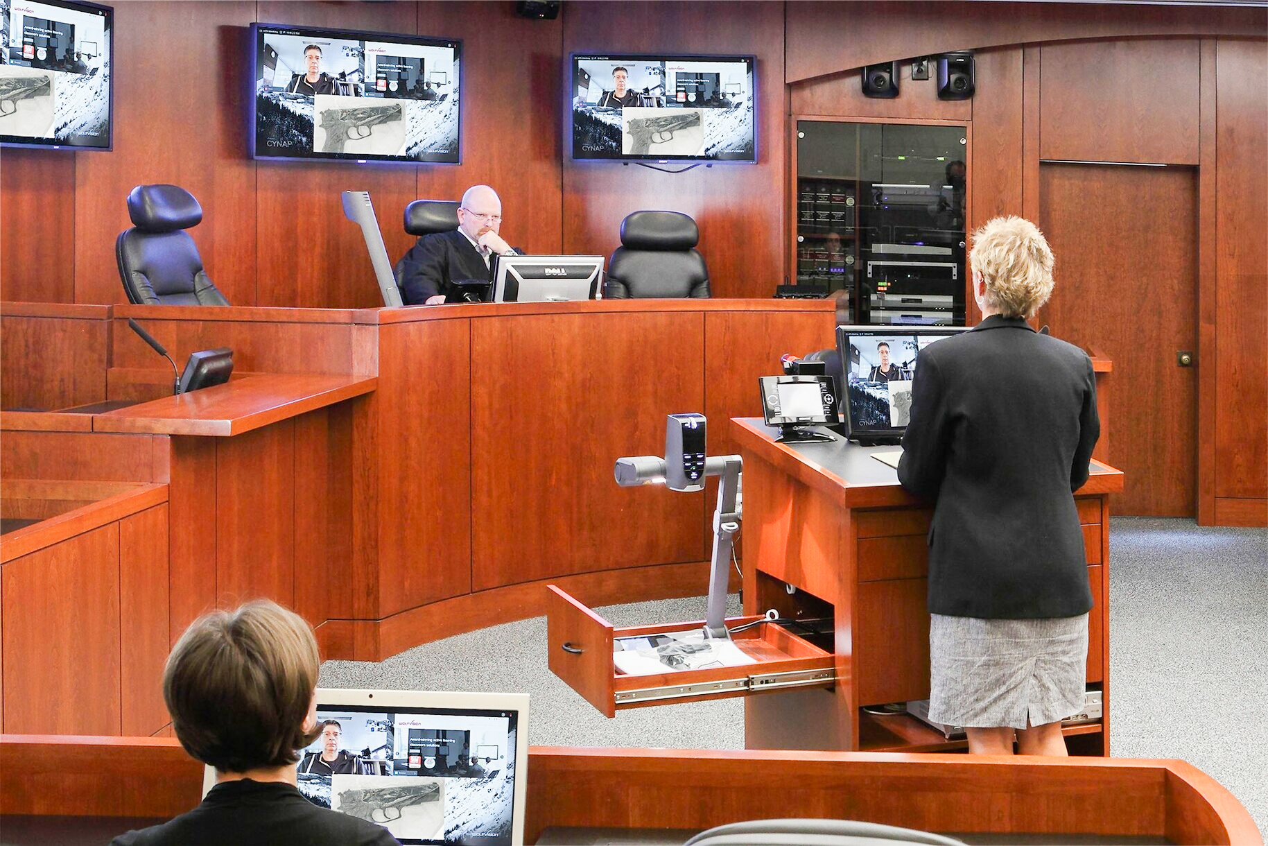 A courtroom with high resolution displays and projectors for evidence